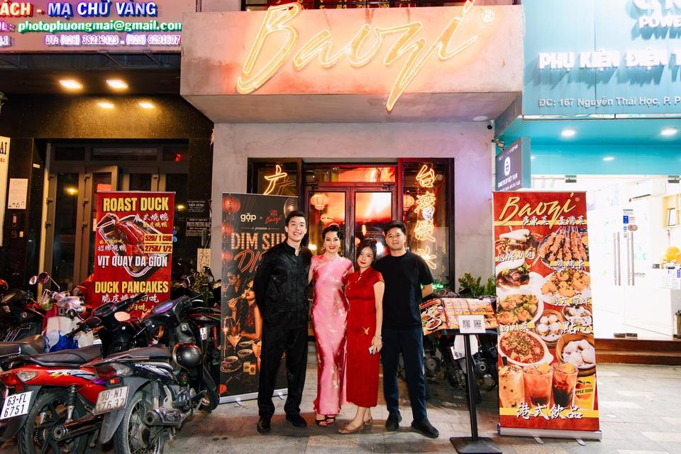 Four people dressed up outside the neon-lit venue for Dim Sum Disco