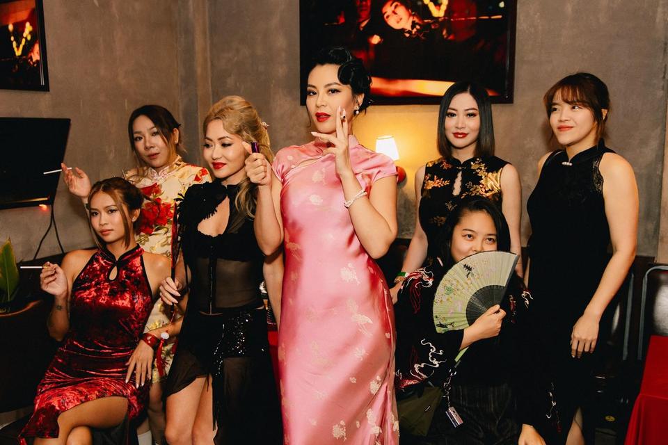 Guests in qipao and vintage Shanghai looks posing at Dim Sum Disco